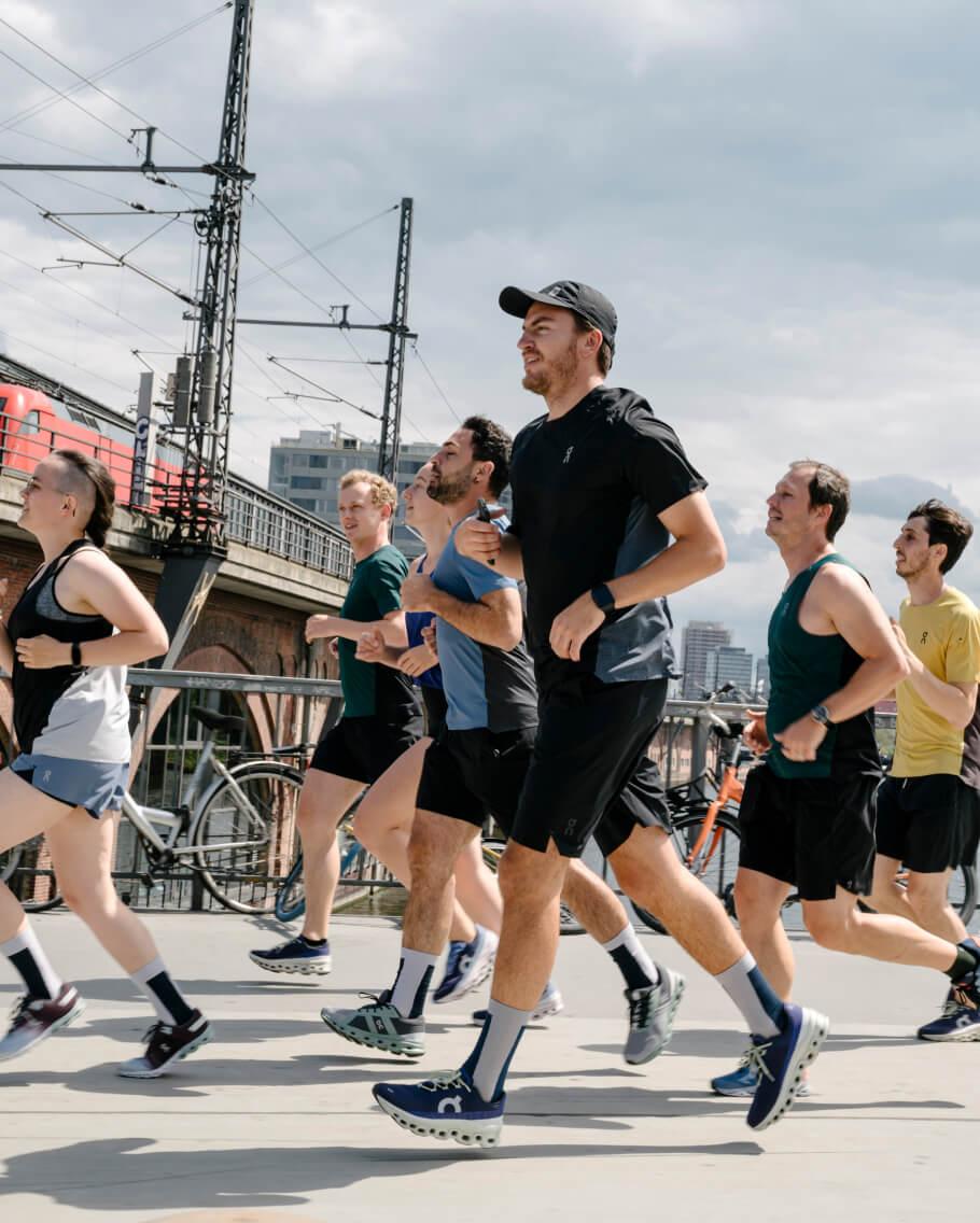 A group of people running at a running event