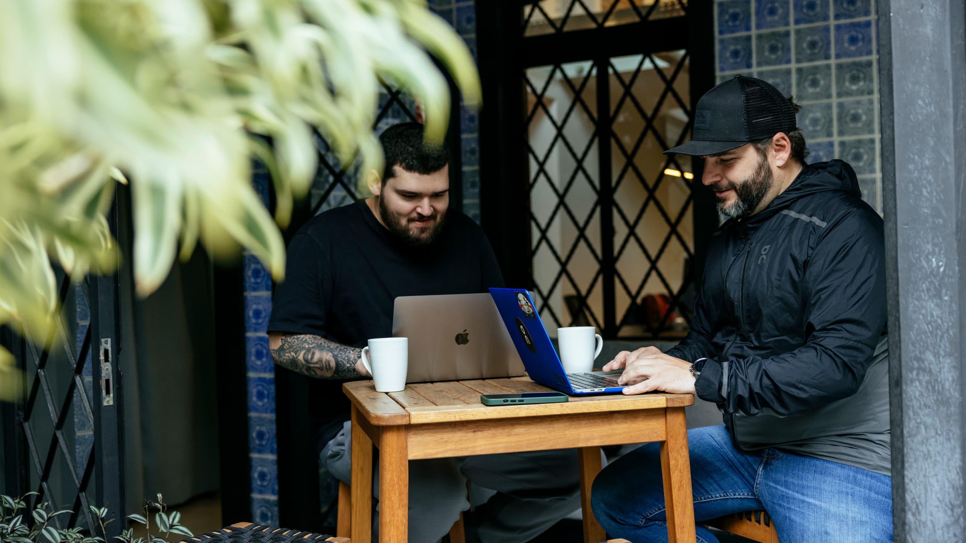 Men sitting at a table in a coffee shop