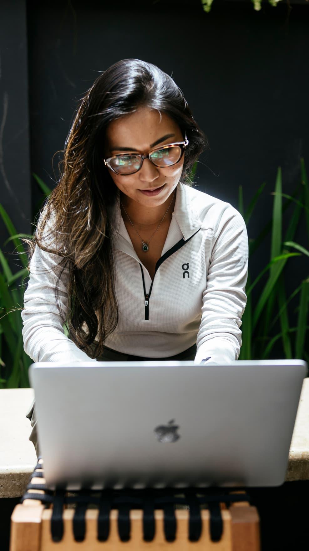 Young businesswoman working on laptop in the office