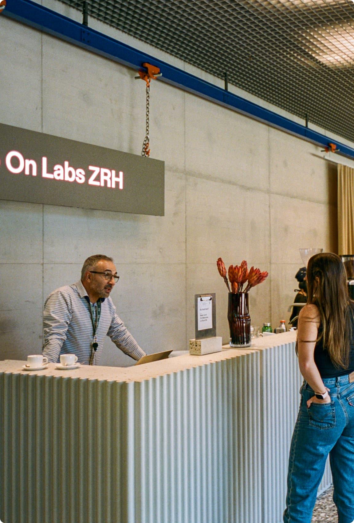 Two people talking at the On Labs reception