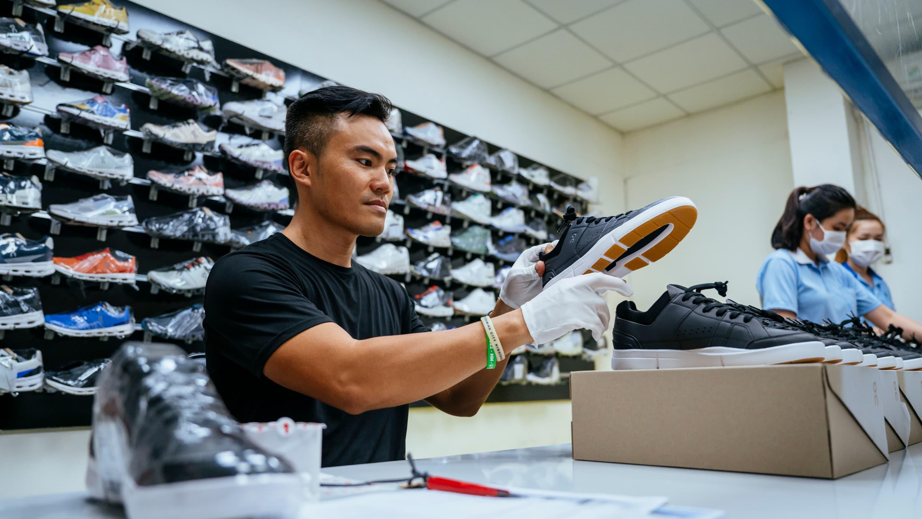 A man checks shoes quality